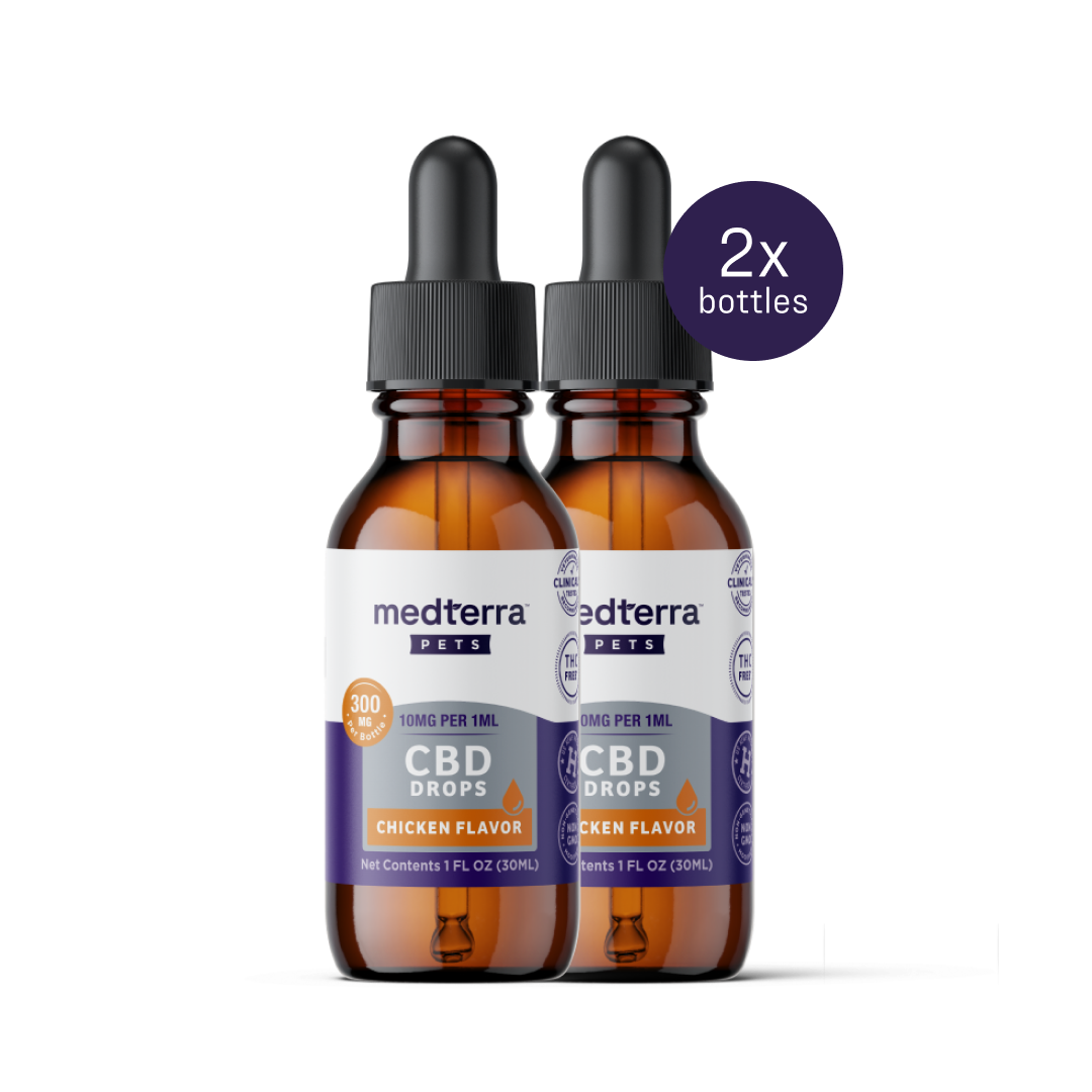 Two brown bottles with black droppers are labeled "Medterra Pet CBD Drops," chicken-flavored for general wellness. Each bottle shows "300mg CBD," delivering "10mg per 1ml." The image emphasizes promoting joint health in your pets with "2x bottles.