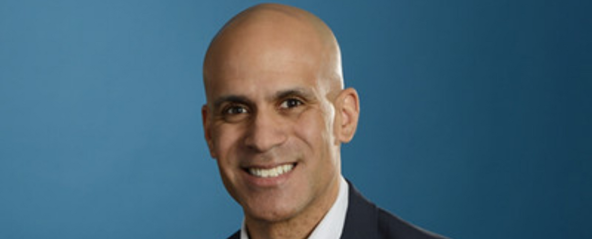 Gregory Reeder, new CEO of Medterra CBD, smiling against a blue background