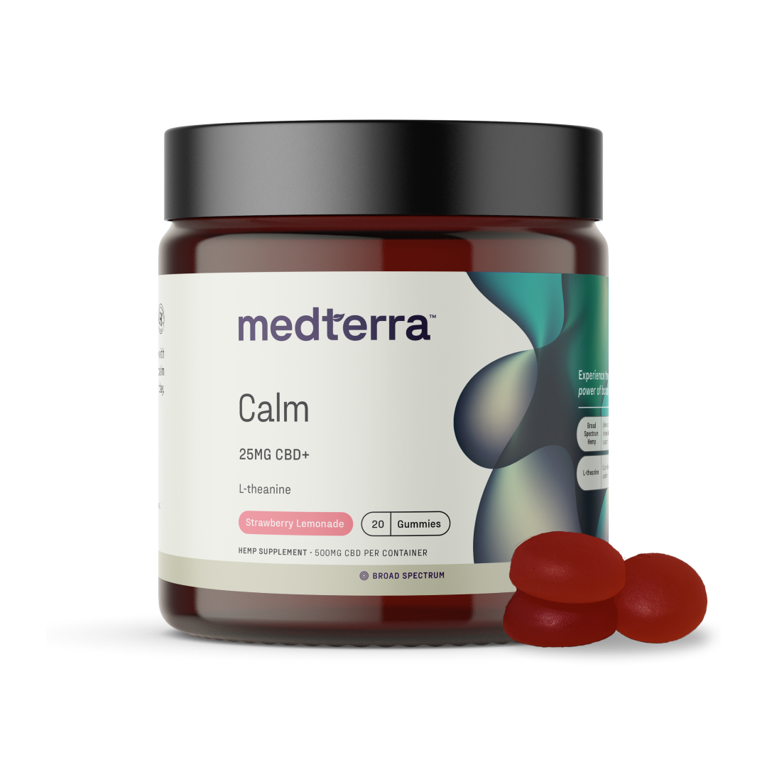 A jar of Medterra's Calm CBD Gummies featuring 25mg of broad-spectrum CBD and L-theanine in a strawberry lemonade flavor. The jar contains 20 gummies, with three red gummies placed outside the jar. The label highlights the product's stress reduction and calming properties.