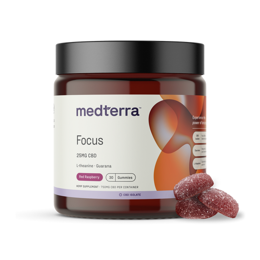 A jar of Medterra Focus Gummies is displayed with the label indicating 25mg of CBD for cognitive enhancement, along with L-theanine and guarana for sustained energy, in a red raspberry flavor. The amber-colored container with a black lid holds 30 gummies, some of which are placed outside the jar.