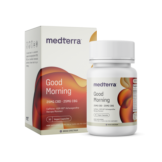 A white and orange box and bottle of Medterra Good Morning Capsules. The label specifies that it contains 25mg of CBD, 25mg of CBG, caffeine, KSM-66® Ashwagandha, and Bacopa Monnieri for cognitive support. The bottle contains 30 vegan capsules.