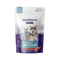 A package of Medterra Pet CBD Calming Chews with bacon flavor is displayed. The front showcases images of a gray cat and a brown and white dog. The package indicates that each chew contains 10mg, includes 30 soft chews, and highlights that it is clinically tested, THC-free, and enriched with Valerian Root for added relaxation.