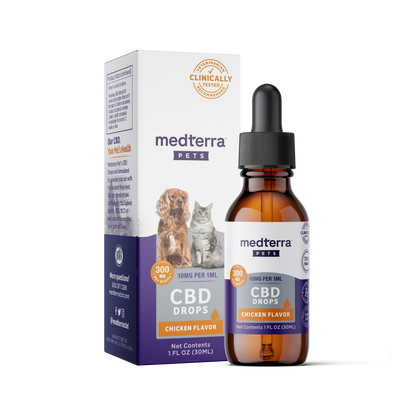 A brown glass dropper bottle labeled "Medterra Pet CBD Drops, Chicken Flavor" is placed in front of its box. The box, featuring images of a dog and a cat, highlights "300mg CBD" and "Clinically Tested." It boasts natural beef and chicken flavorings with organic ingredients. Net contents: 1 fluid ounce (30 mL).