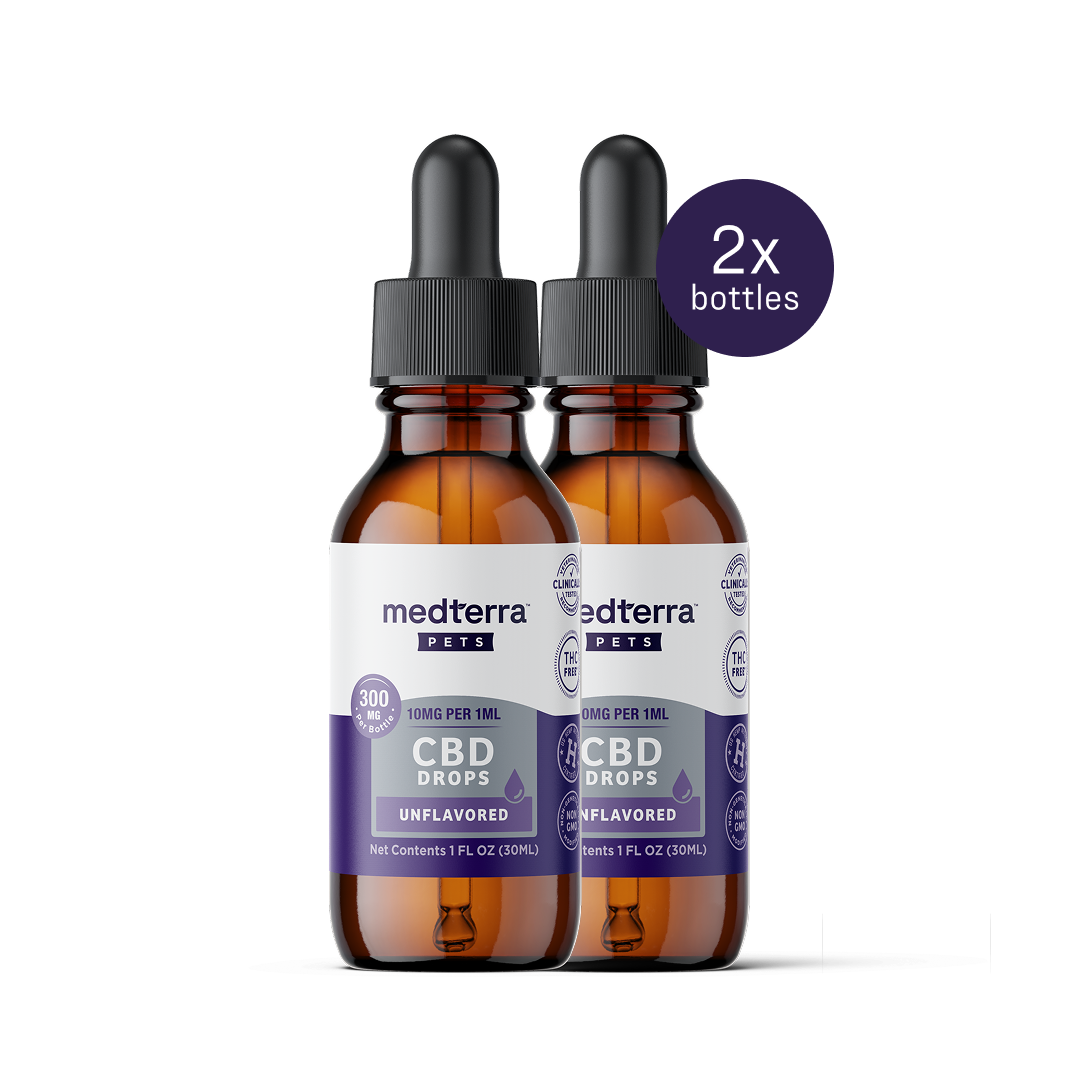 Two bottles of Medterra Pet CBD Drops, unflavored with droppers, each labeled 300mg and 10mg per 1ml in a 1 fl. oz. bottle. A note says "2x bottles," ideal for supporting your pet's joint health.