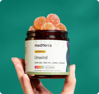 A hand holds a jar labeled "Medterra Rest & Restore Bundle," featuring gummy supplements with 50mg CBD, 5mg THC, and 100mg L-Theanine. The sugar-coated gummies are set against a plain teal background.