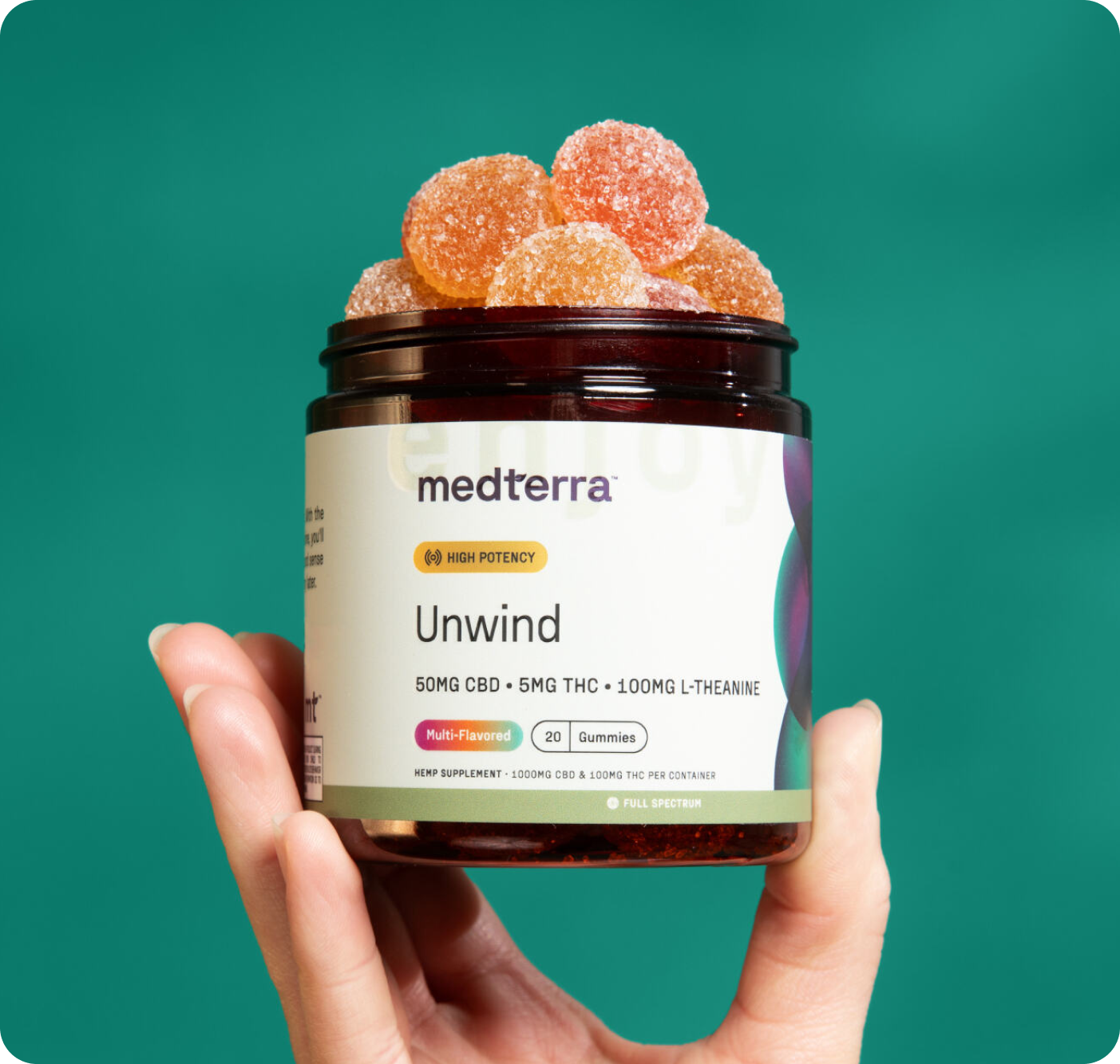 A hand holds a jar labeled "medterra Mood Gummies Bundle" with orange gummies visible inside. The label shows 50mg CBD, 5mg THC, and 100mg L-Theanine. The jar is marked "High Potency," with "Multi-flavored" and "Gummies" at the bottom.