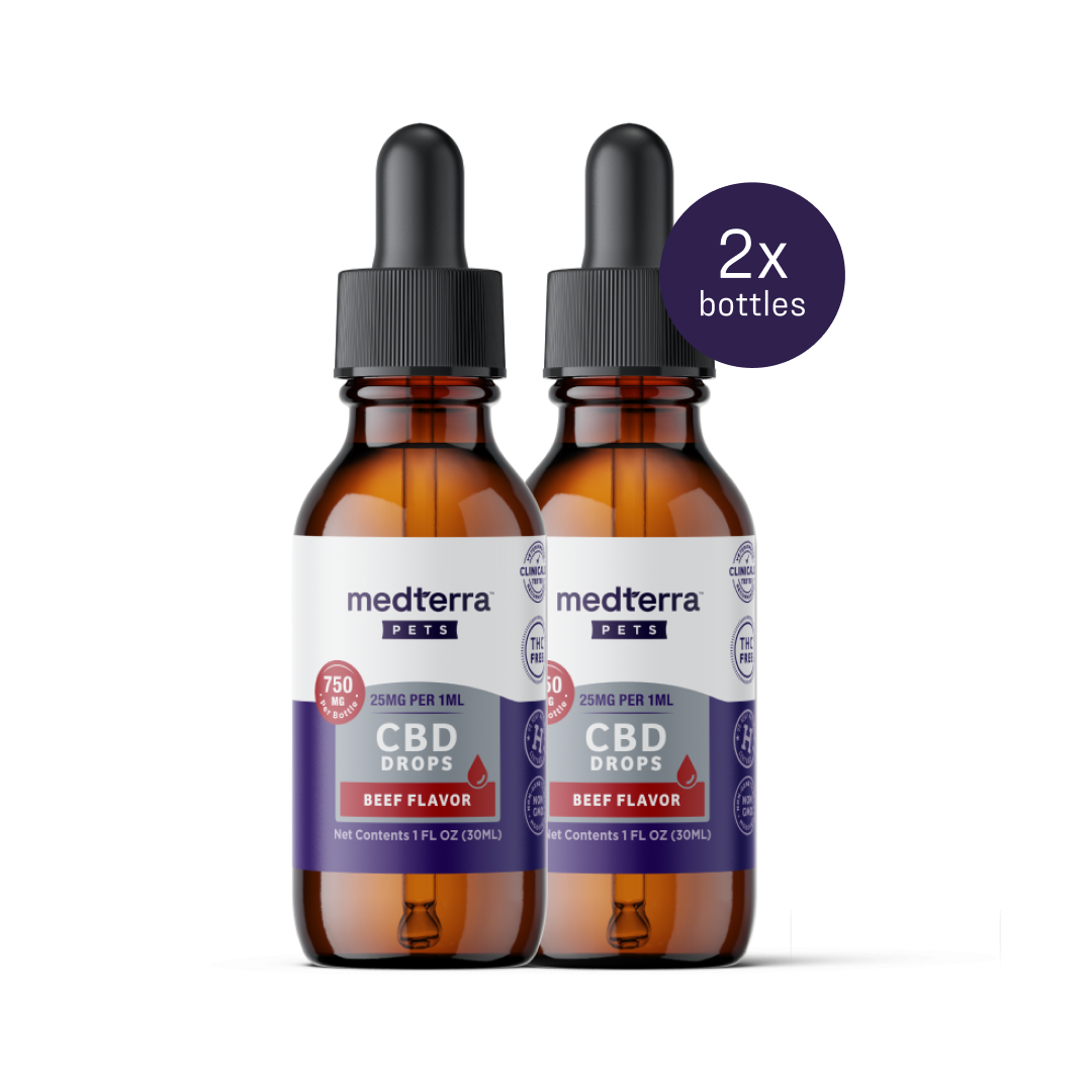 Displayed are two bottles of Medterra's Pet CBD Drops in beef flavor. Each 1 fl. oz. (30 mL) bottle contains 750 mg of CBD and offers flexible serving sizes for convenience. The dropper caps are designed for precise dosing, and a "2x bottles" label is placed in the top right corner.