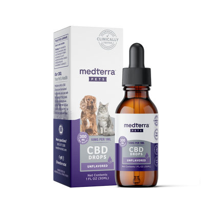 A bottle of Medterra Pet CBD Drops (10mg per 1ml, unflavored) is positioned in front of its box. The packaging features images of a dog and a cat, indicating the product is intended for pets. The box and bottle display dosage information and volume (1 FL OZ/30mL), highlighting its organic ingredients.