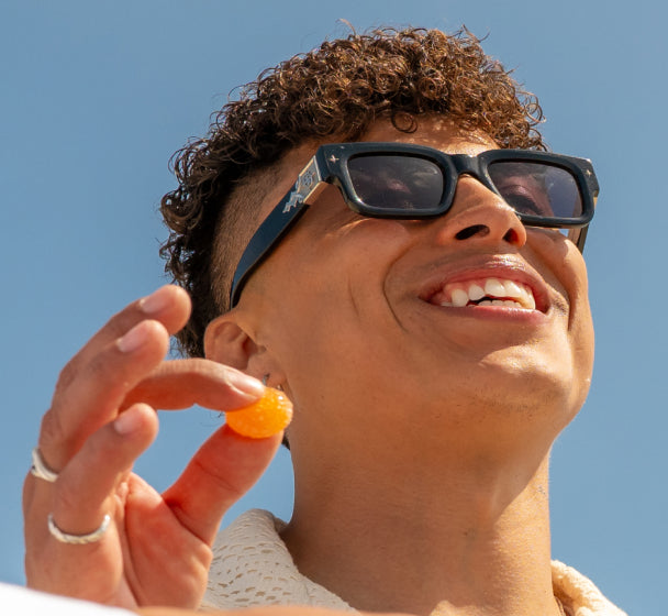 Men Holding Gummies in Hand